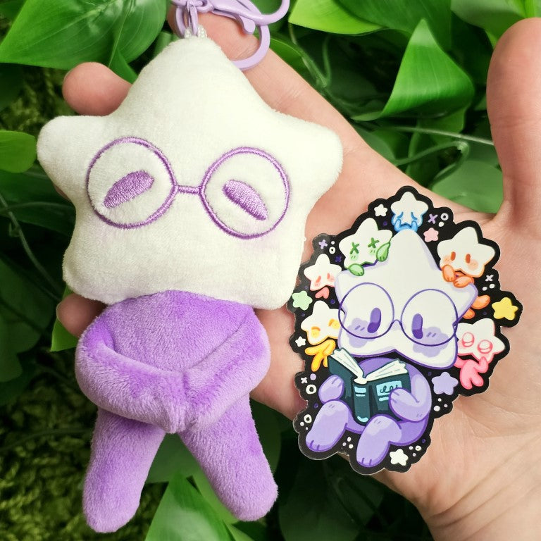 A purple star baby plushie and the coordinating sticker.