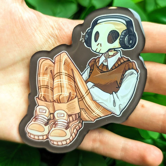 Magnet with an aesthetic skeleton reclined and relaxed while listening to his favorite tunes.