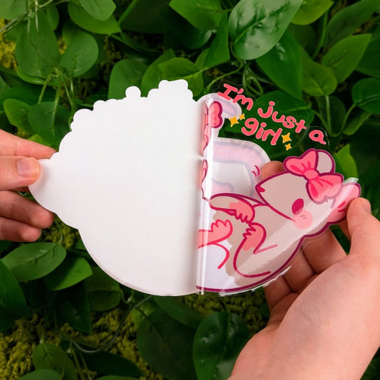 Peeling Just A Girl Rat window sticker in Milky's hand