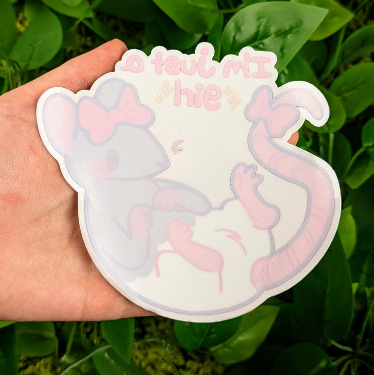 Unpeeled Just A Girl Rat window sticker in Milky's hand