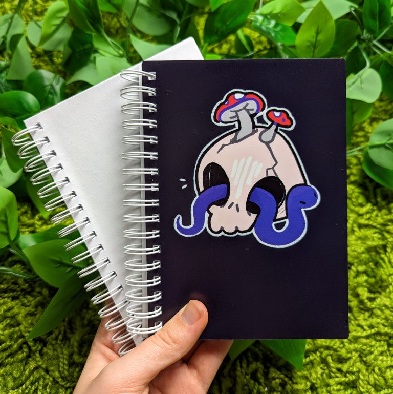 Skull and snake sticker book with a blue snake
