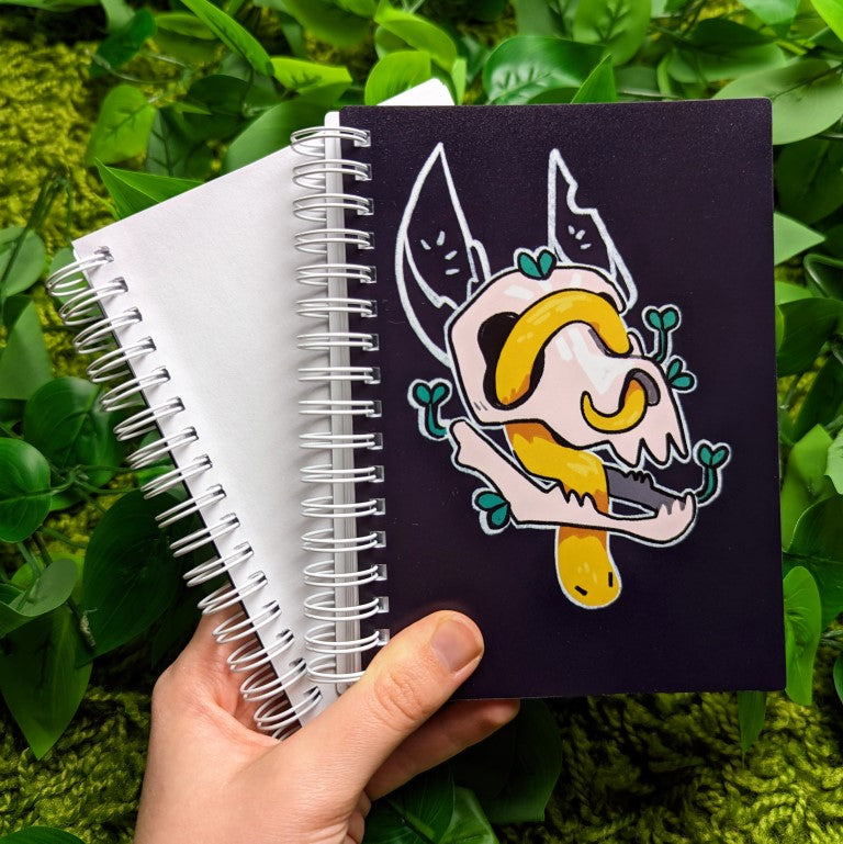 Skull and snake sticker book with a yellow snake