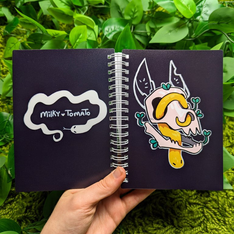 Front and back of yellow skull and snake sticker book