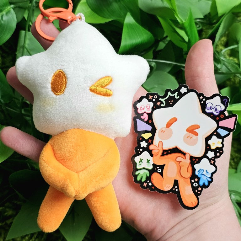 An orange star baby plushie and the coordinating sticker.