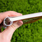 View of the thickness of the small Skeleton Cade blue mushroom large reusable sticker book.