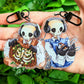 A pair of a brown and a blue chilling aesthetic skeleton cade keychains.