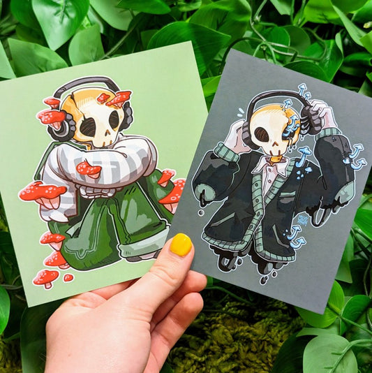 Two mini prints featuring an aesthetic skeleton design, one with red mushrooms and one with blue.