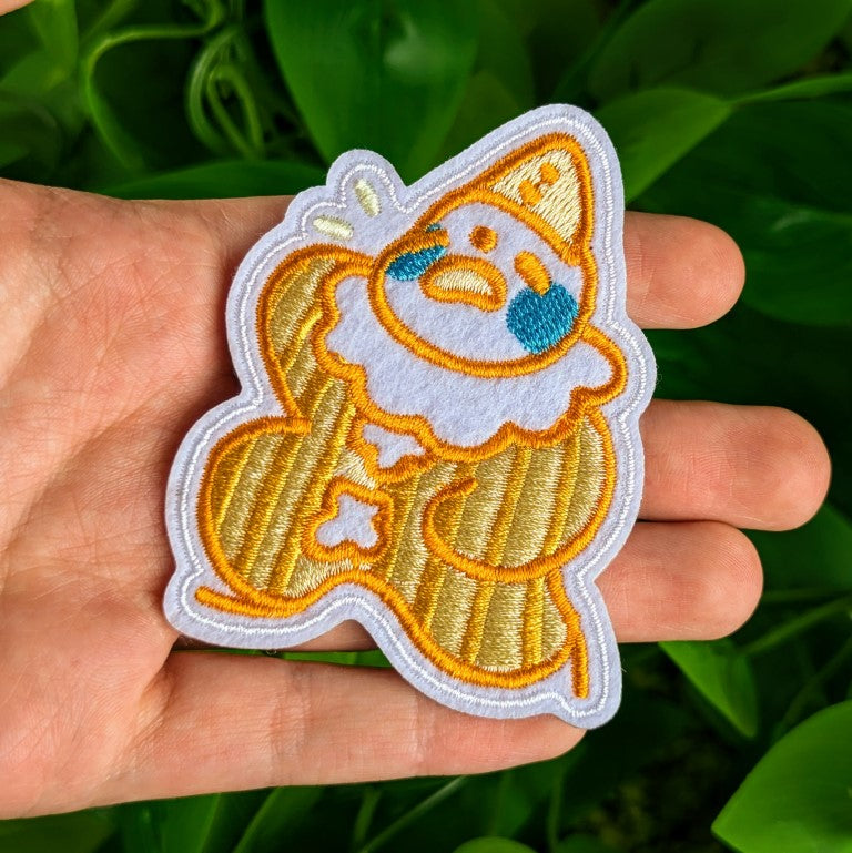 Yellow Clown patch in Milky's hand