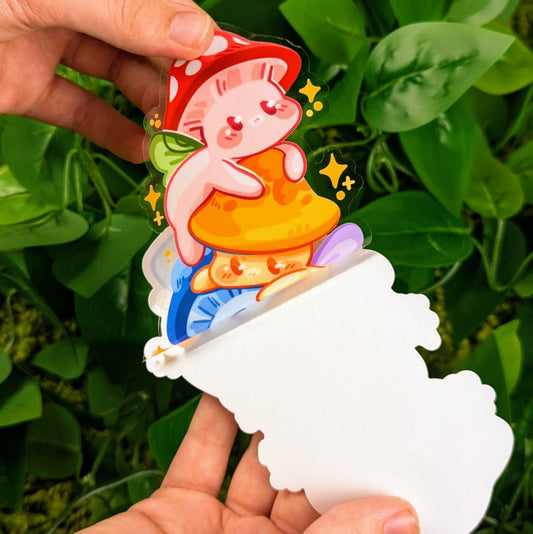 Peeling Mushroom Fairies Stack window sticker in Milky's Hand