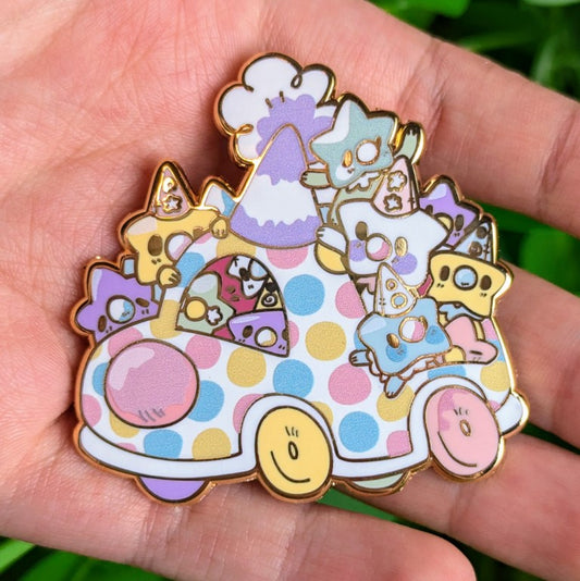 Star Baby Clown Car enamel pin in Milky's hand