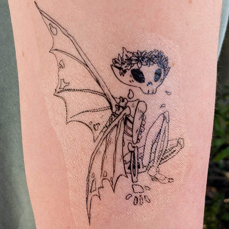 Grey Ink Gothic Fairy On Skull Tattoo Design
