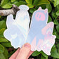 The angel and devil ghost stickers with the adhesive protectant sheet on the front of the sticker.