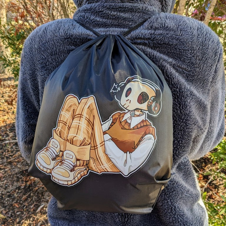 A person wearing a drawstring bag with an aesthetic skeleton design.
