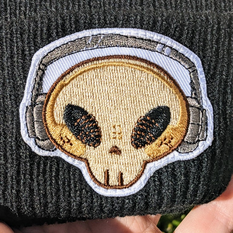 Close up of aesthetic skeleton beanie patch featuring Skeleton Cade's head